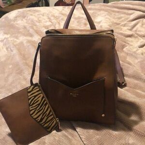 Brown leather backpack with detachable change purse.